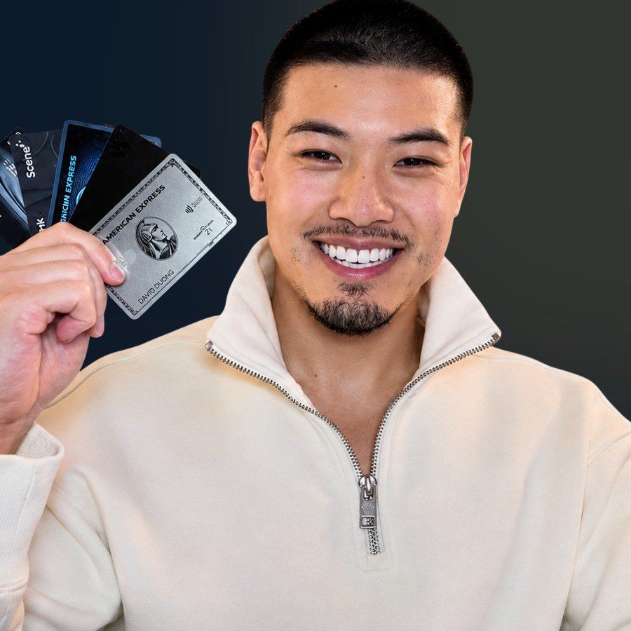 David holding his travel credit cards
